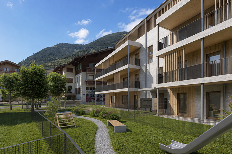 Grüner Innenhof mit Spielbereich im Wohnprojekt Holz im Glück in Bruck